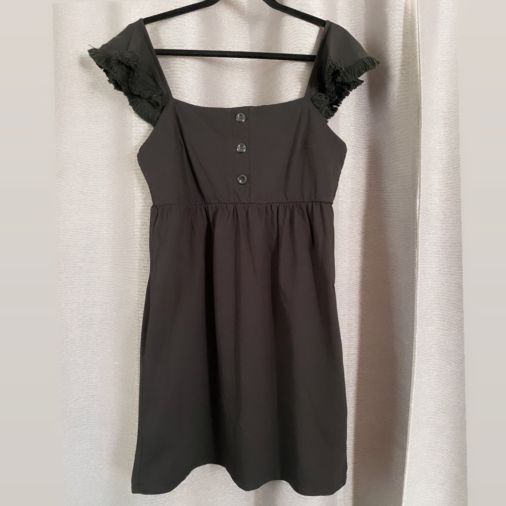 Black off the shoulder dress.